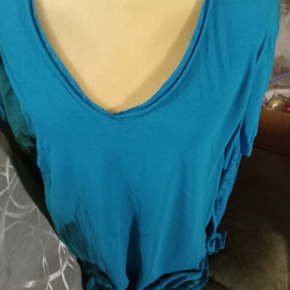 V-Neck long sleeve woman's top with stretchy lace sleeves.